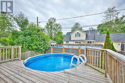 Above-ground pool with attached deck -