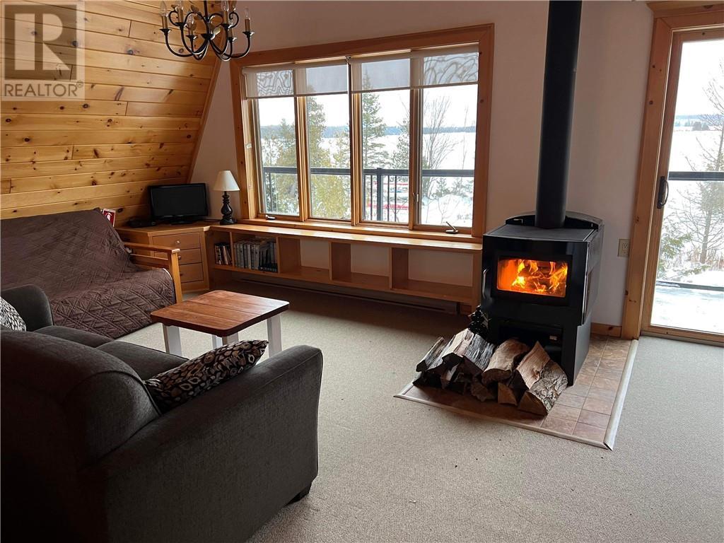 322 Cosby Subd Road, Mindemoya, ON - Indoor Photo Showing Living Room With Fireplace
