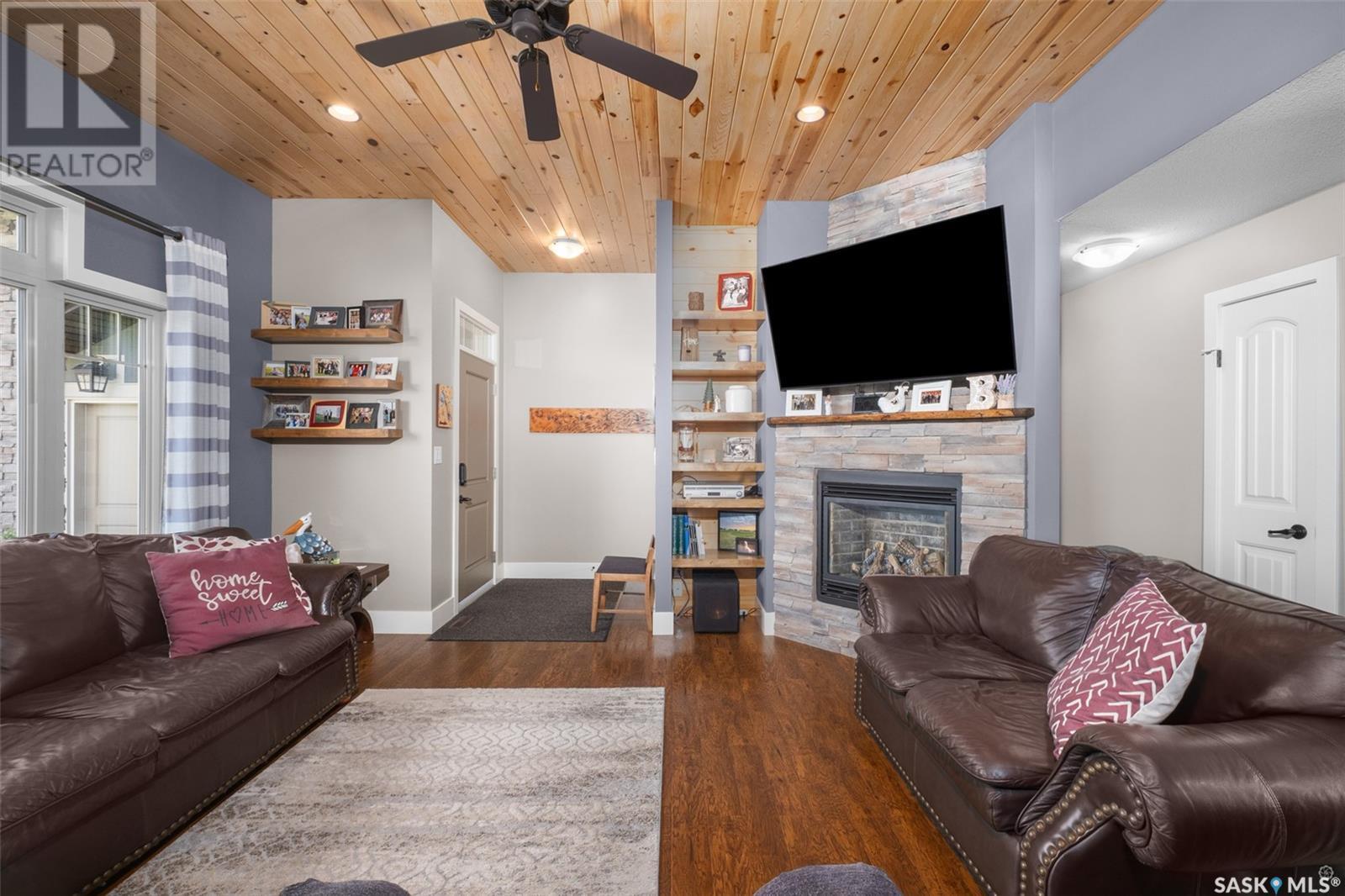 205 Aspen Cove, Paddockwood Rm No. 520, SK - Indoor Photo Showing Living Room With Fireplace