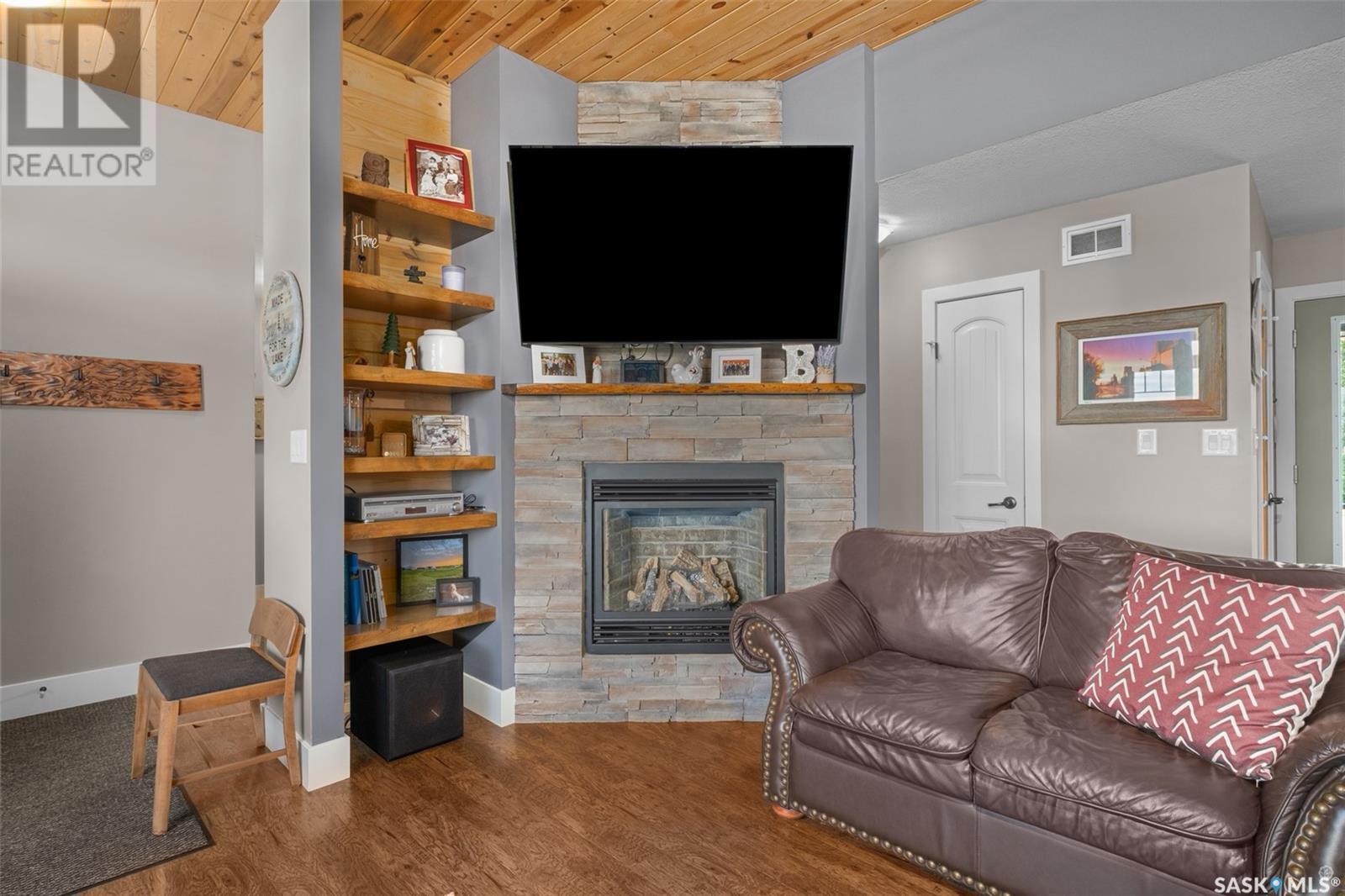 205 Aspen Cove, Paddockwood Rm No. 520, SK - Indoor Photo Showing Living Room With Fireplace