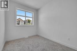 Additional bedroom - Photo of a similar home in the community. -