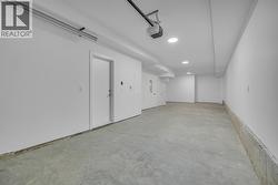 Double car tandem garage - Photo of a similar home in the community. -