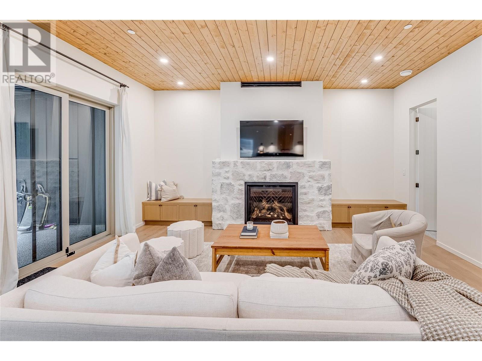 9963 Purcell Drive, Silver Star, BC - Indoor Photo Showing Other Room With Fireplace