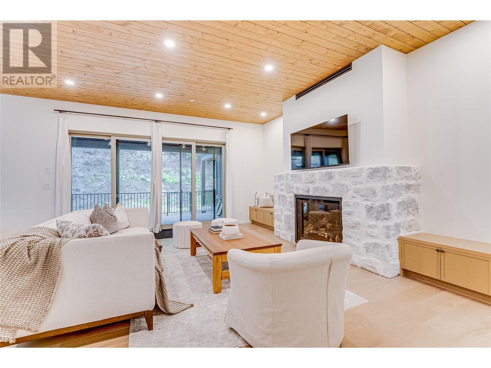 9963 Purcell Drive, Silver Star, BC - Indoor Photo Showing Living Room With Fireplace