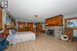 Primary Bedroom with Stone Fireplace -