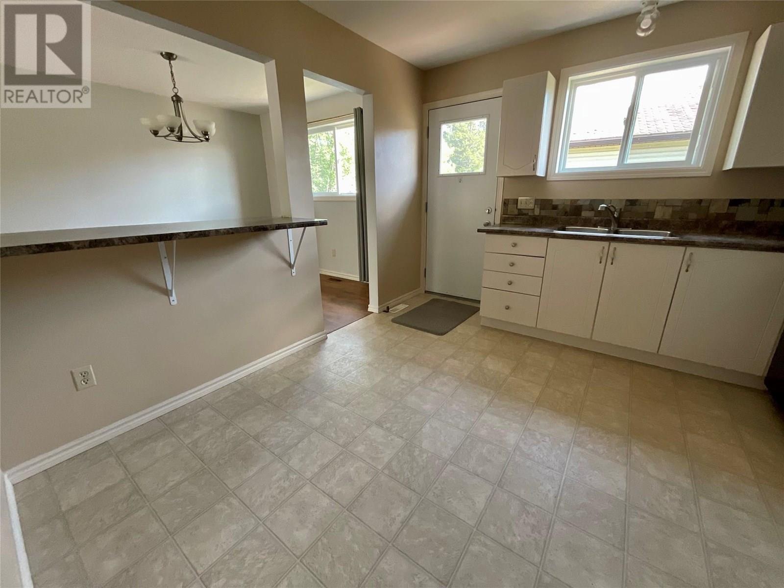 103 Hambrook Lane, Tumbler Ridge, BC - Indoor Photo Showing Kitchen With Double Sink