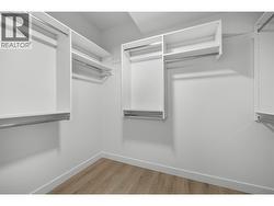 Primary walk-in closet. -