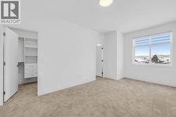 Primary bedroom. Photo of a similar home in the community. -