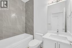 Top floor bathroom. Photo of a similar home in the community. -