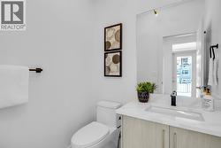 Main floor powder room - photos are of a similar home in the community. -