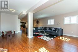 Living room featuring hardwood / wood-style flooring -