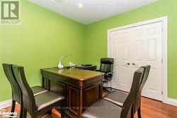 Home office with light hardwood / wood-style floors -