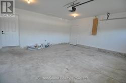 Man door to Garage and to outside -