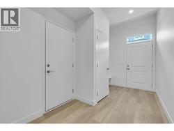 Mudroom & lower level entrance, as well as garage access. -