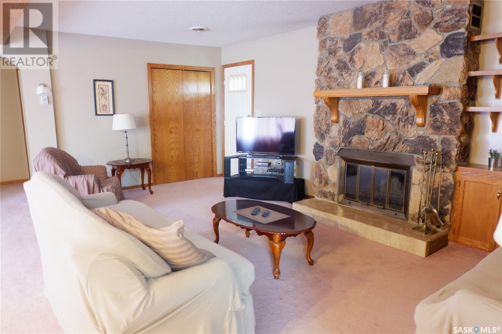 48 2Nd Avenue E, Lafleche, SK - Indoor Photo Showing Living Room With Fireplace