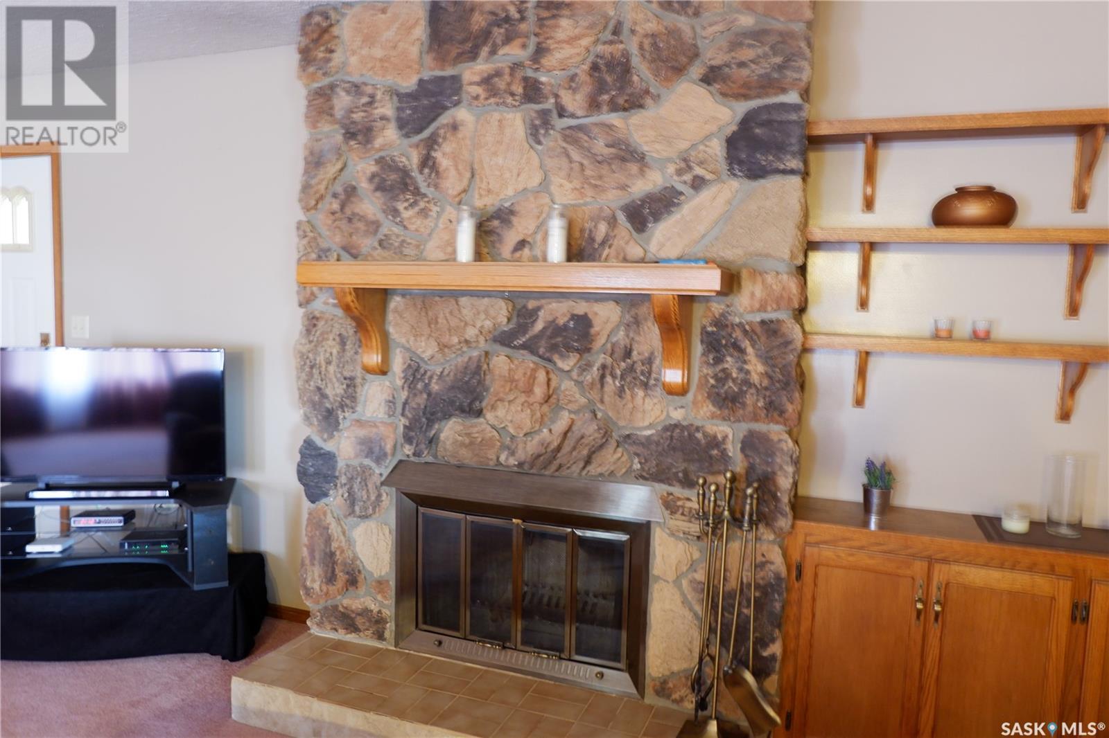 48 2Nd Avenue E, Lafleche, SK - Indoor Photo Showing Living Room With Fireplace