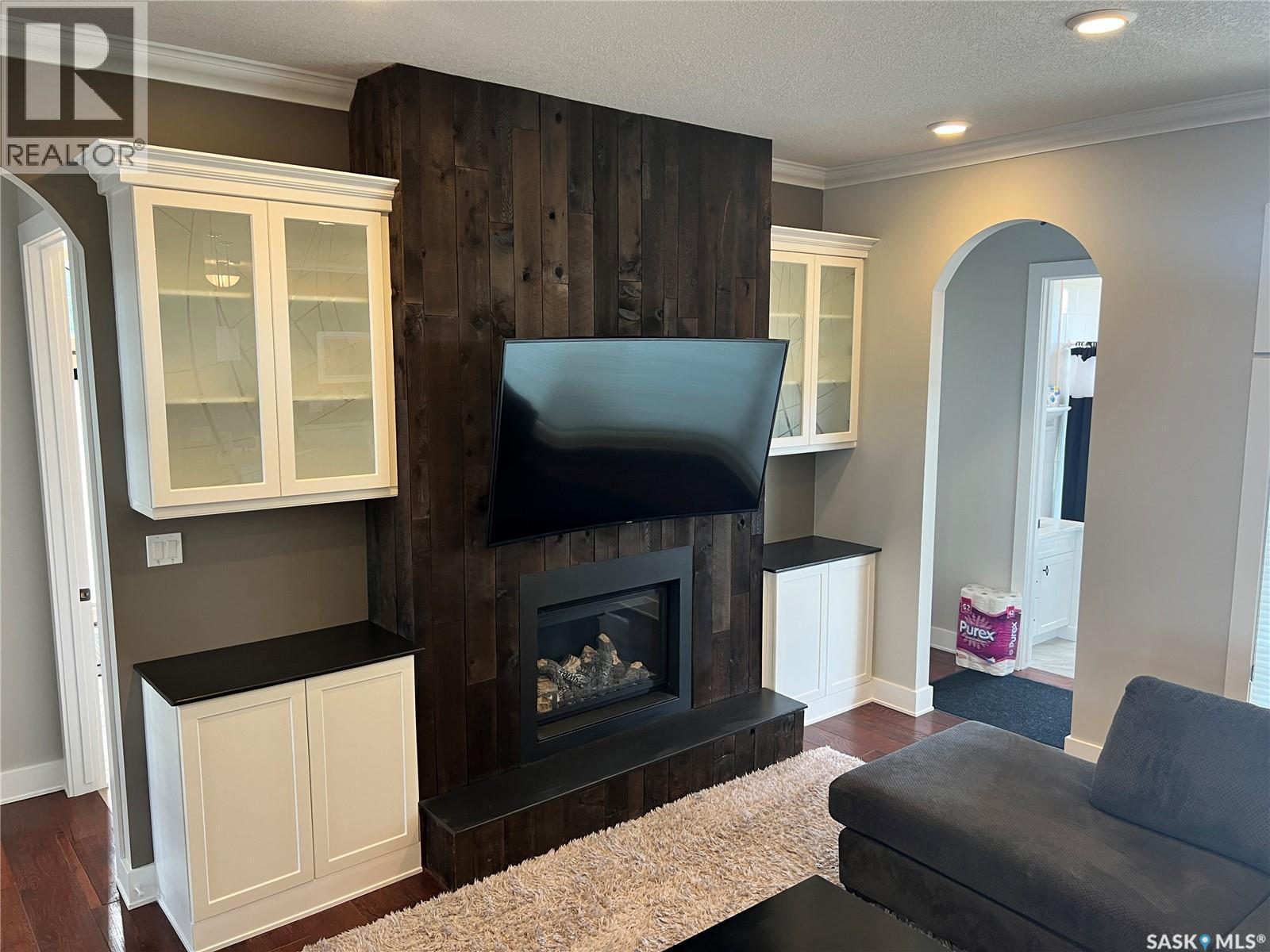 Natalie Acres, Waldeck, SK - Indoor Photo Showing Living Room With Fireplace