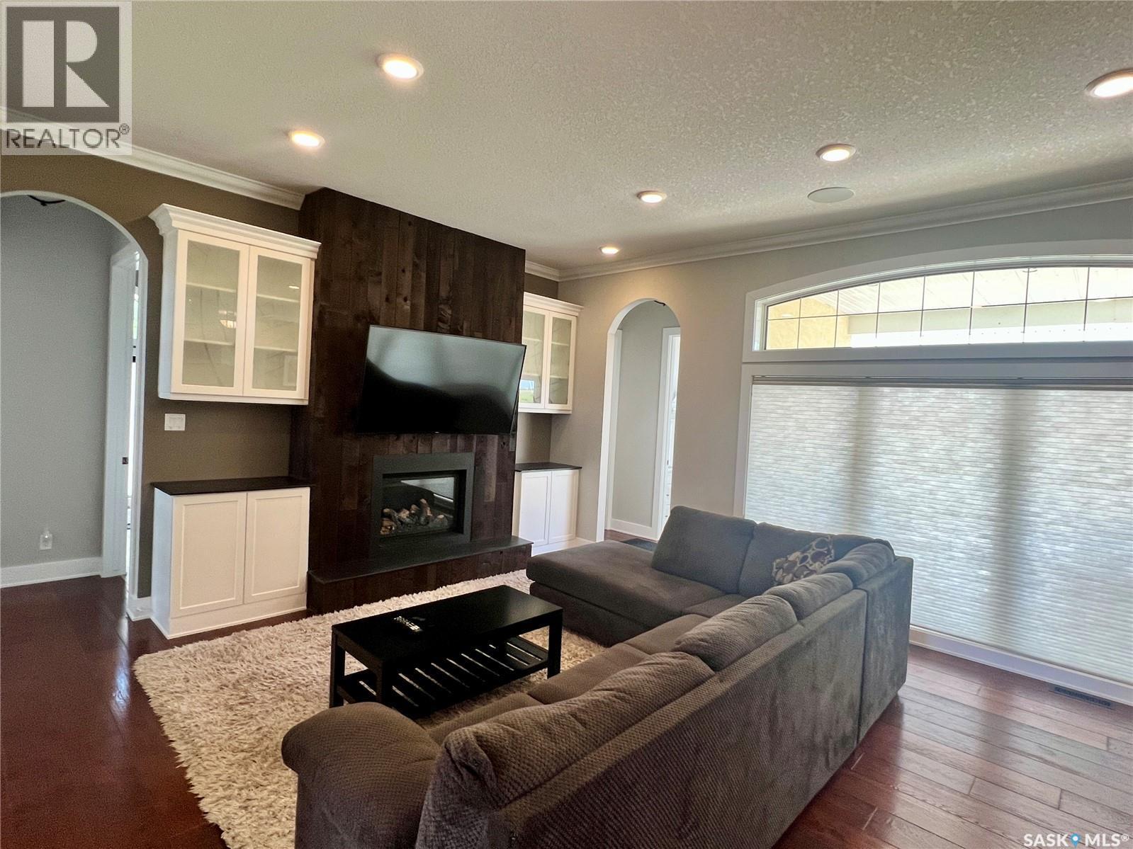Natalie Acres, Waldeck, SK - Indoor Photo Showing Living Room With Fireplace