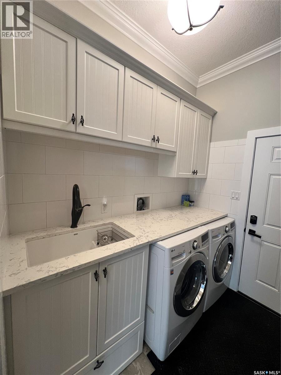 Natalie Acres, Waldeck, SK - Indoor Photo Showing Laundry Room
