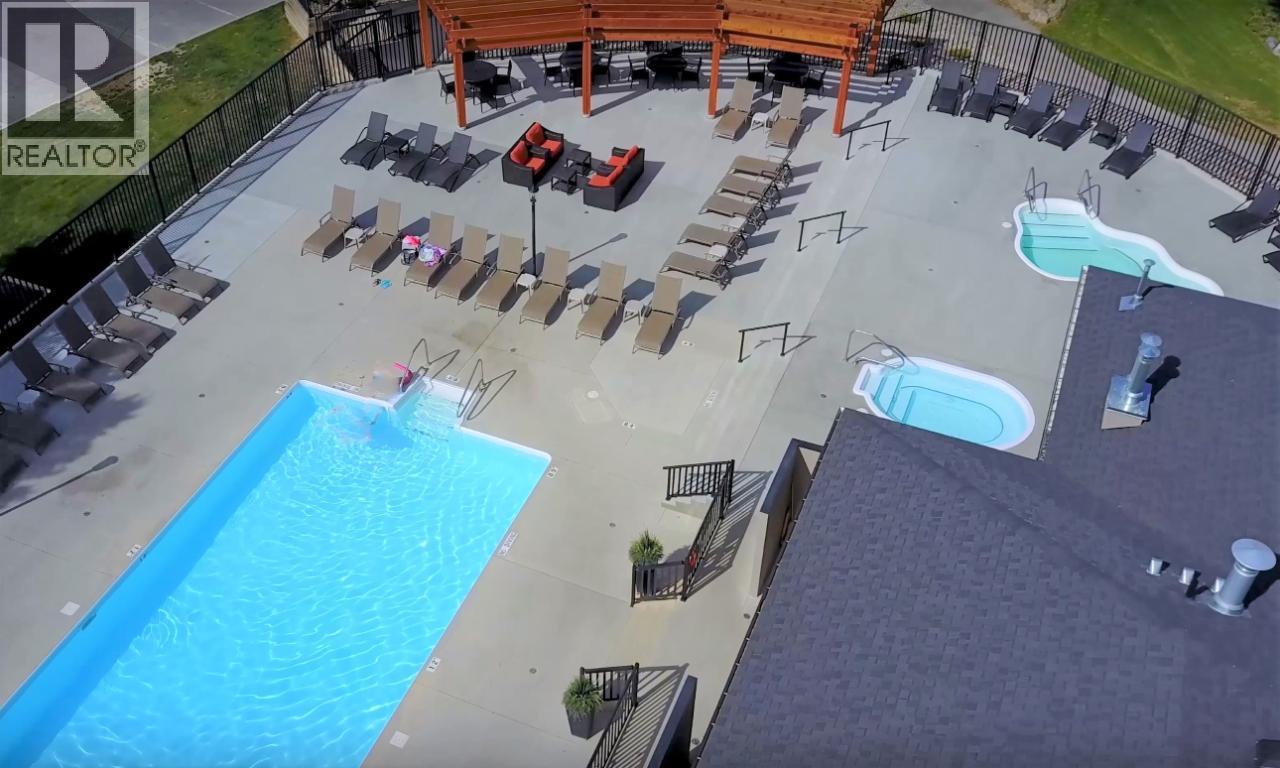 400 Bighorn Boulevard Unit# 416 F, Radium Hot Springs, BC - Outdoor With In Ground Pool With View