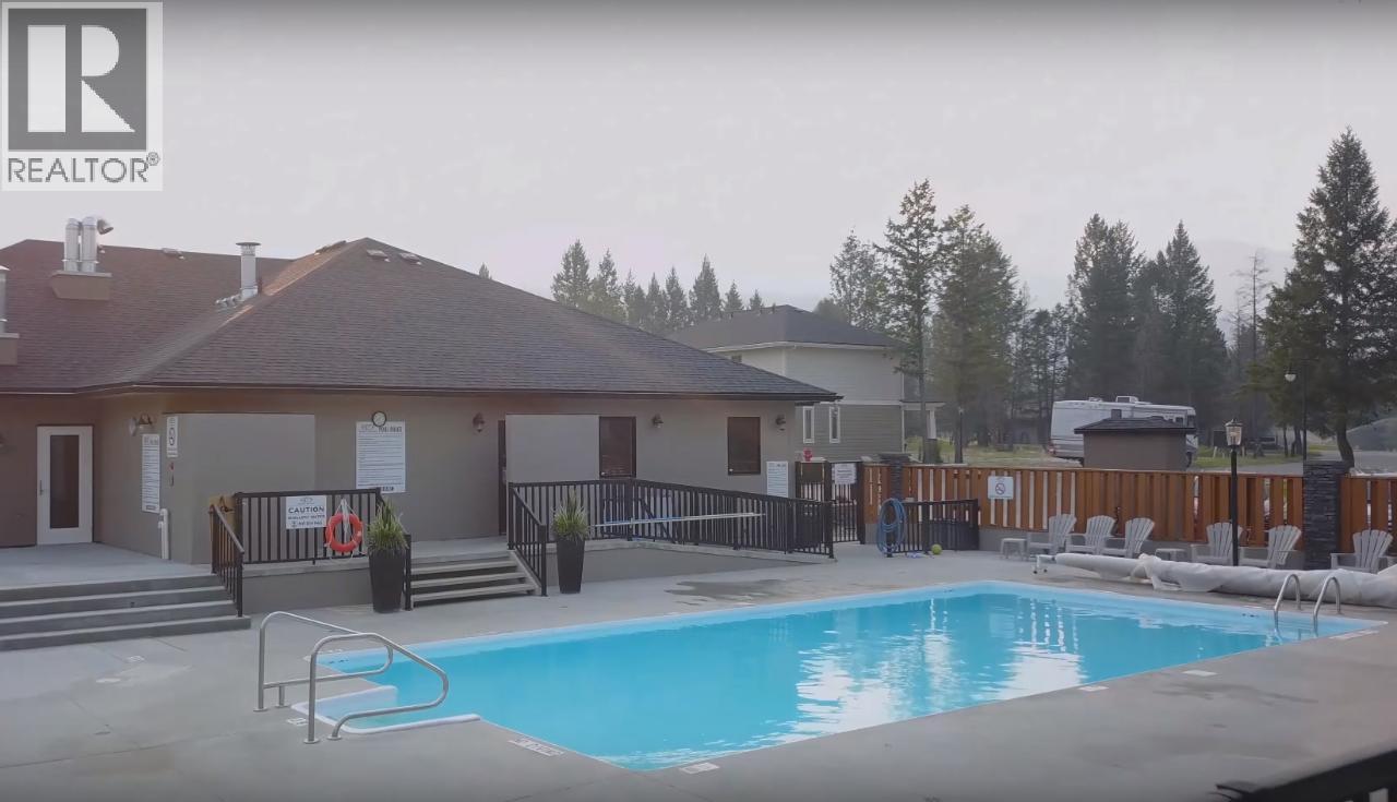 400 Bighorn Boulevard Unit# 416 F, Radium Hot Springs, BC - Outdoor With In Ground Pool With Deck Patio Veranda