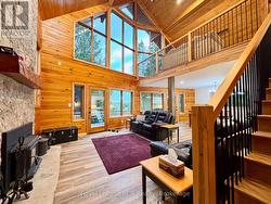 Floor-to-ceiling glass & wood. -