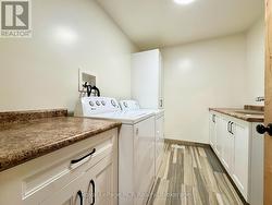 Main floor finished laundry room. -
