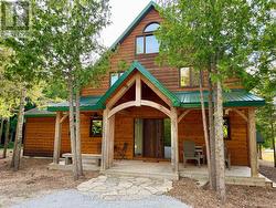 Stunning covered timber-frame & stone front entry -