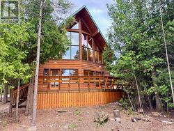 Custom natural wood & modern glass exterior. -