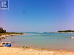 Sandy beach 5min drive by car or boat. -