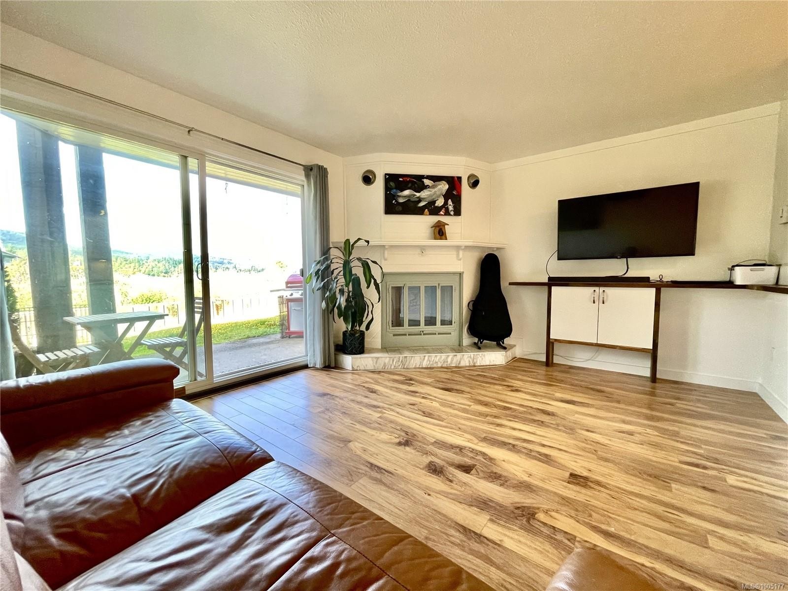 106-1991 Kaltasin Rd, Sooke, BC - Indoor Photo Showing Living Room With Fireplace