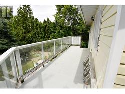 Deck at back at home with stairs to lower level -