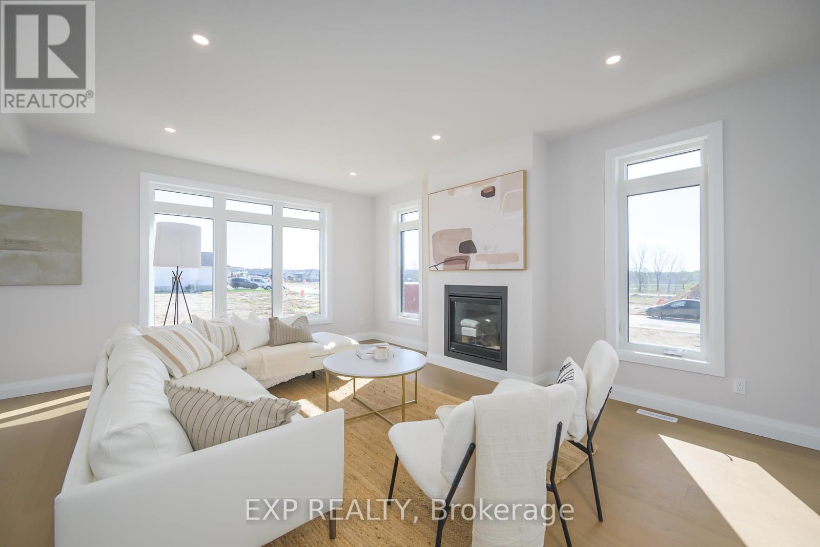 76 Dearing Drive, South Huron (Stephen), ON - Indoor Photo Showing Living Room With Fireplace