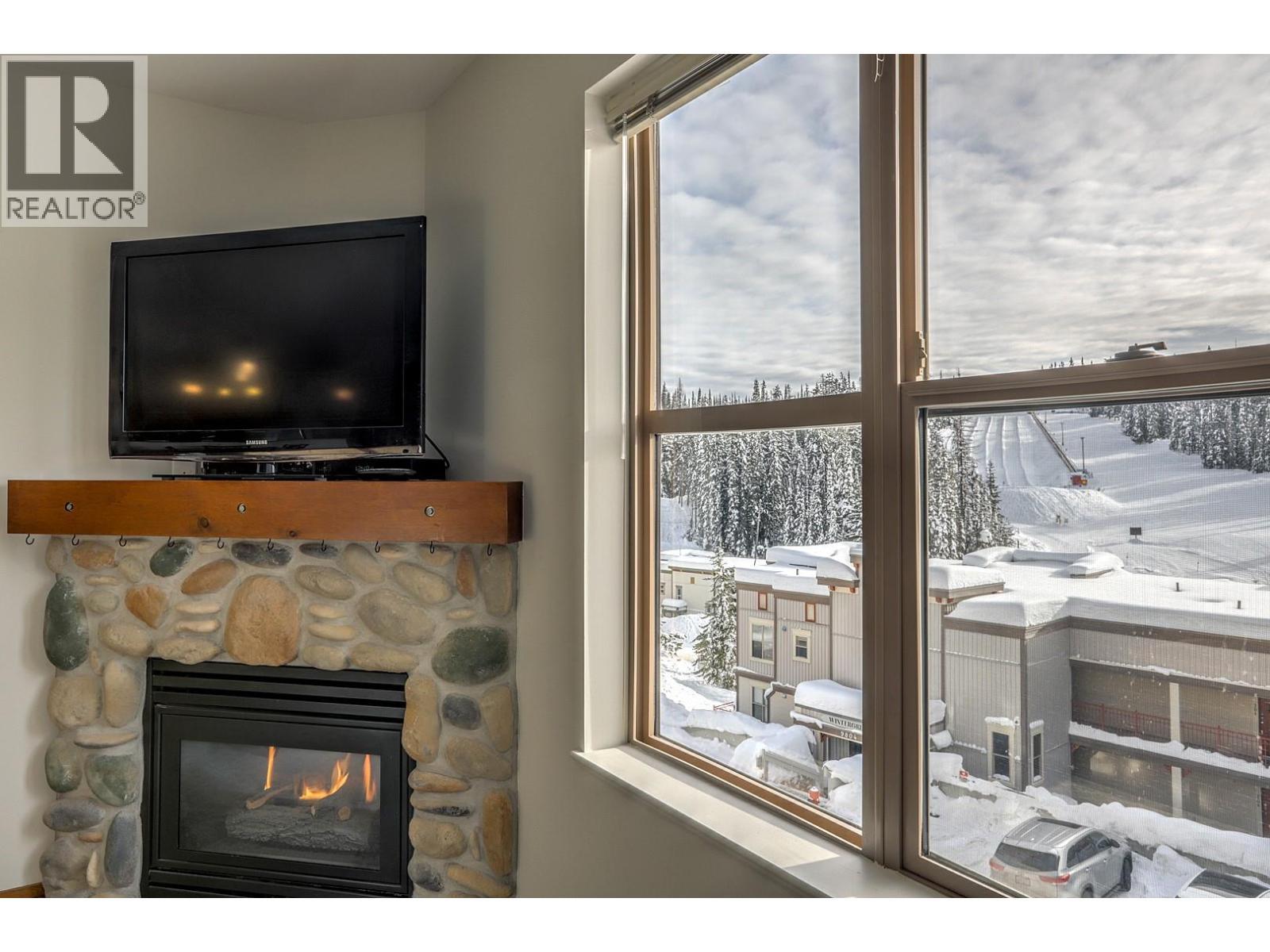 9802 Silver Star Road Unit# 306, Silver Star, BC - Indoor Photo Showing Living Room With Fireplace
