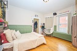 Main Flr BR with hardwood floor and closet -