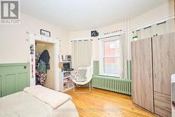 Main Flr BR with hardwood floor and closet -