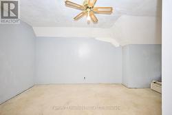 Finished attic with ceiling fan -