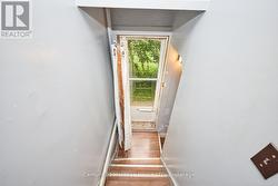 Staircase leading to the side door -