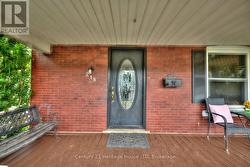 Welcoming enclosed front porch -