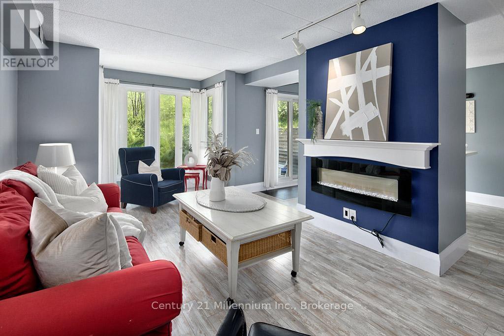 121 - 796404 Grey Road 19, Blue Mountains, ON - Indoor Photo Showing Living Room With Fireplace