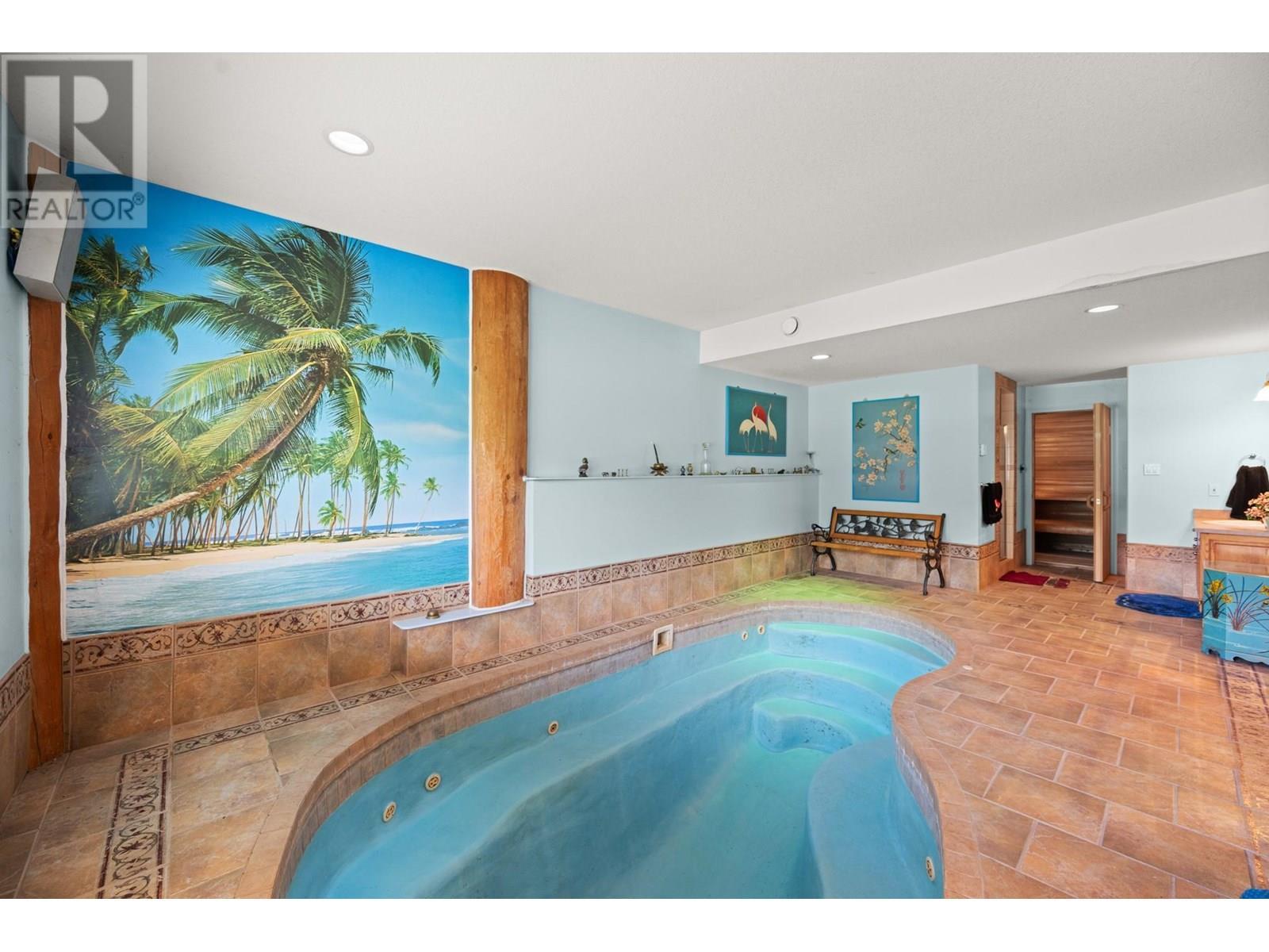 Jetted pool/hot tub with built in seating - 910 Lumby Mabel Lake Road, Lumby, BC
