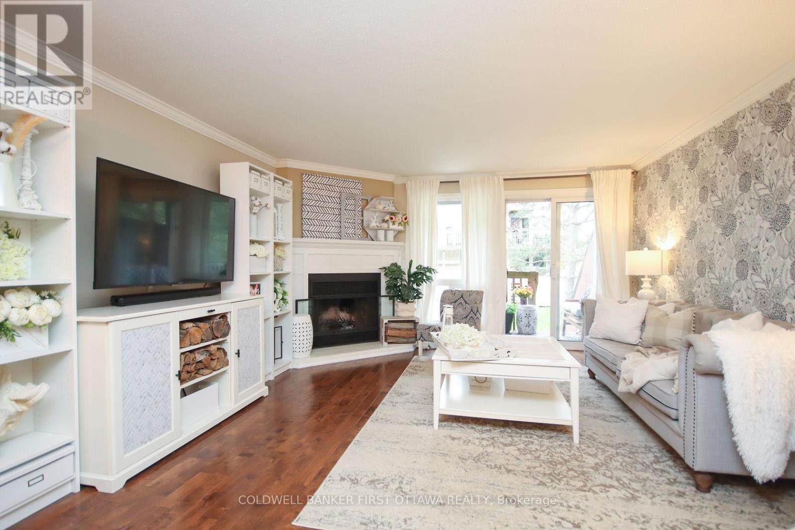 A - 6702 Jeanne D'Arc Boulevard, Ottawa, ON - Indoor Photo Showing Living Room With Fireplace