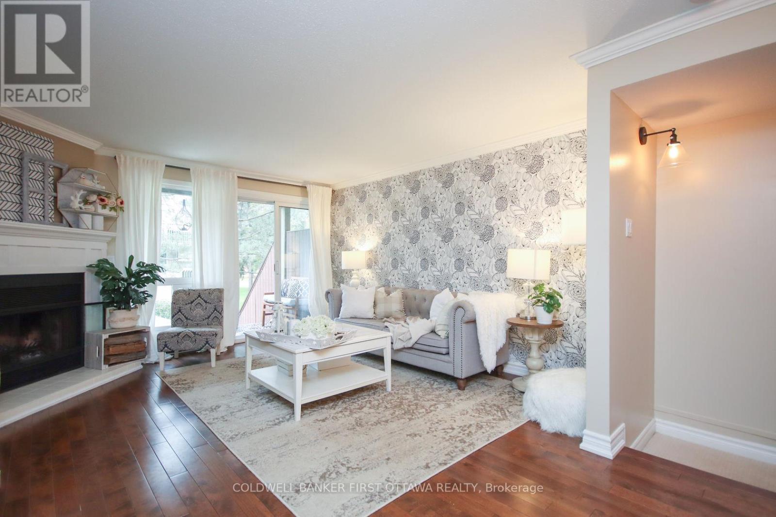 A - 6702 Jeanne D'Arc Boulevard, Ottawa, ON - Indoor Photo Showing Living Room With Fireplace
