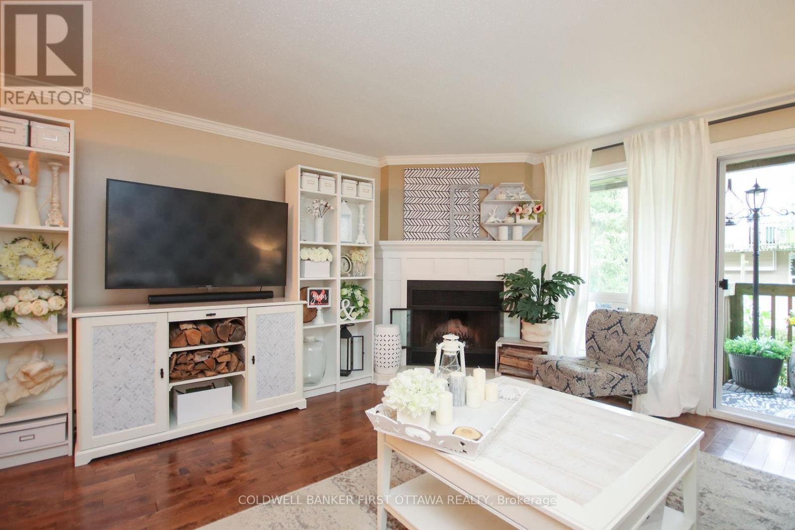 A - 6702 Jeanne D'Arc Boulevard, Ottawa, ON - Indoor Photo Showing Living Room With Fireplace