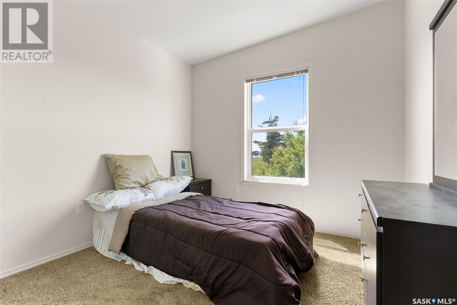 183 Chateau Crescent, Pilot Butte, SK - Indoor Photo Showing Bedroom
