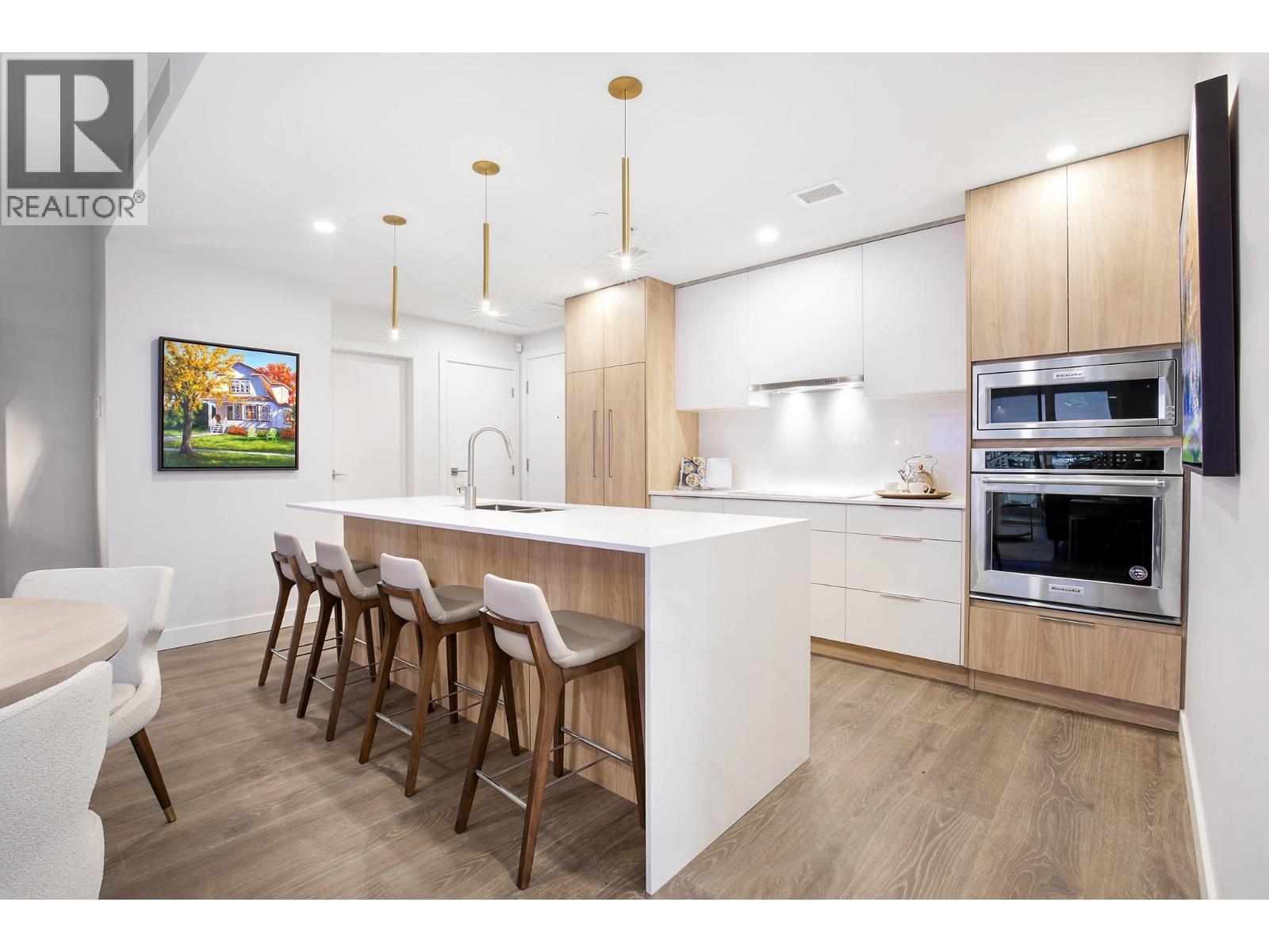 Photos are from our show suite at 238 4th Avenue in Downtown Kamloops, open daily 11-3. Colours, room sizes and finishing are subject to change. Message us for additional information. - 460 Nicola Street Unit# 2201, Kamloops, BC - Indoor Photo Showing Kitchen With Upgraded Kitchen