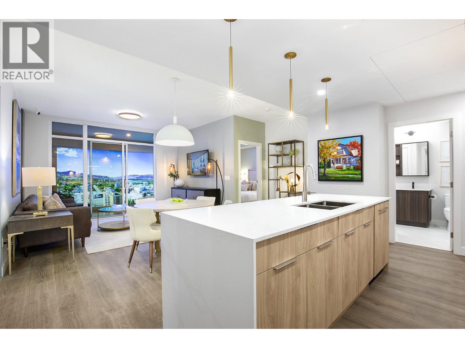 Photos are from our show suite at 238 4th Avenue in Downtown Kamloops, open daily 11-3. Colours, room sizes and finishing are subject to change. Message us for additional information. - 460 Nicola Street Unit# 2201, Kamloops, BC - Indoor Photo Showing Kitchen With Double Sink