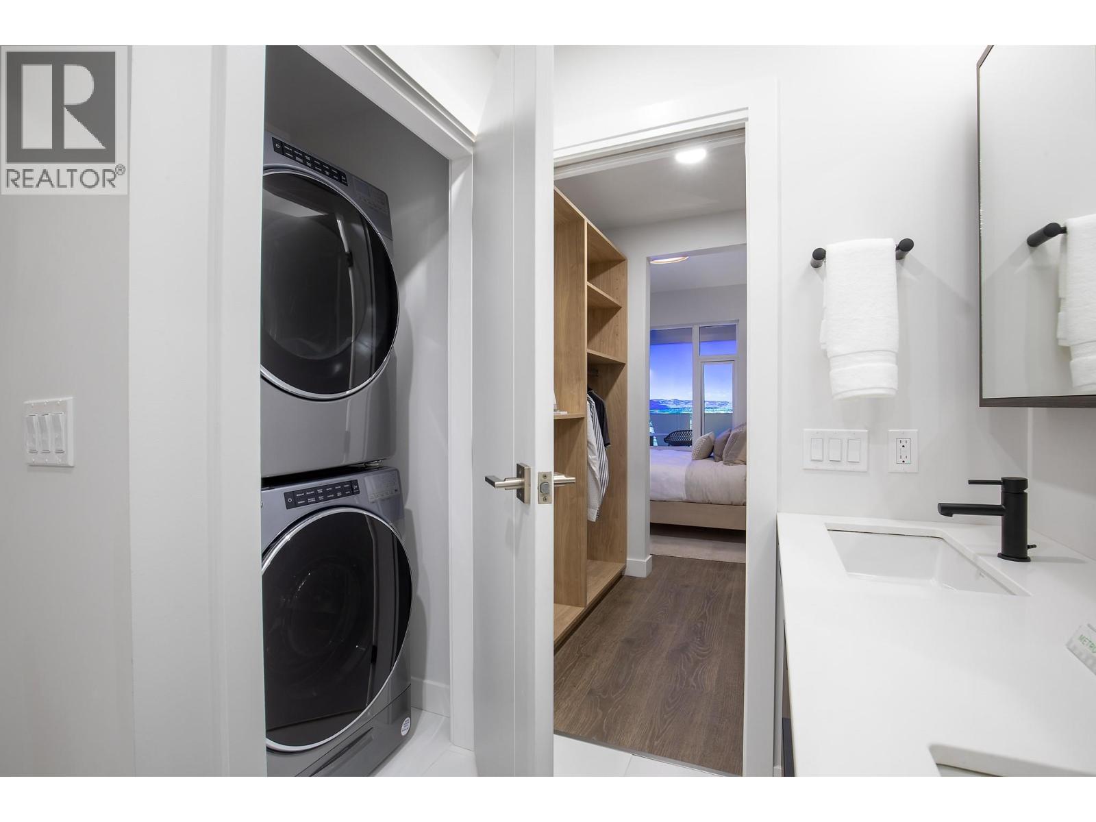 Photos are from our show suite at 238 4th Avenue in Downtown Kamloops, open daily 11-3. Colours, room sizes and finishing are subject to change. Message us for additional information. - 460 Nicola Street Unit# 2201, Kamloops, BC - Indoor Photo Showing Laundry Room