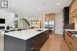 Enjoy a Large Central Island & Sub-Zero Fridge -