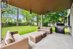 Accordian Glass Doors Open to a Covered Terrace -